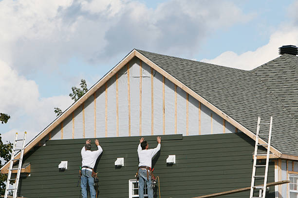 Professional Storm Damage Siding Repair technician working in Fredericksburg, VA